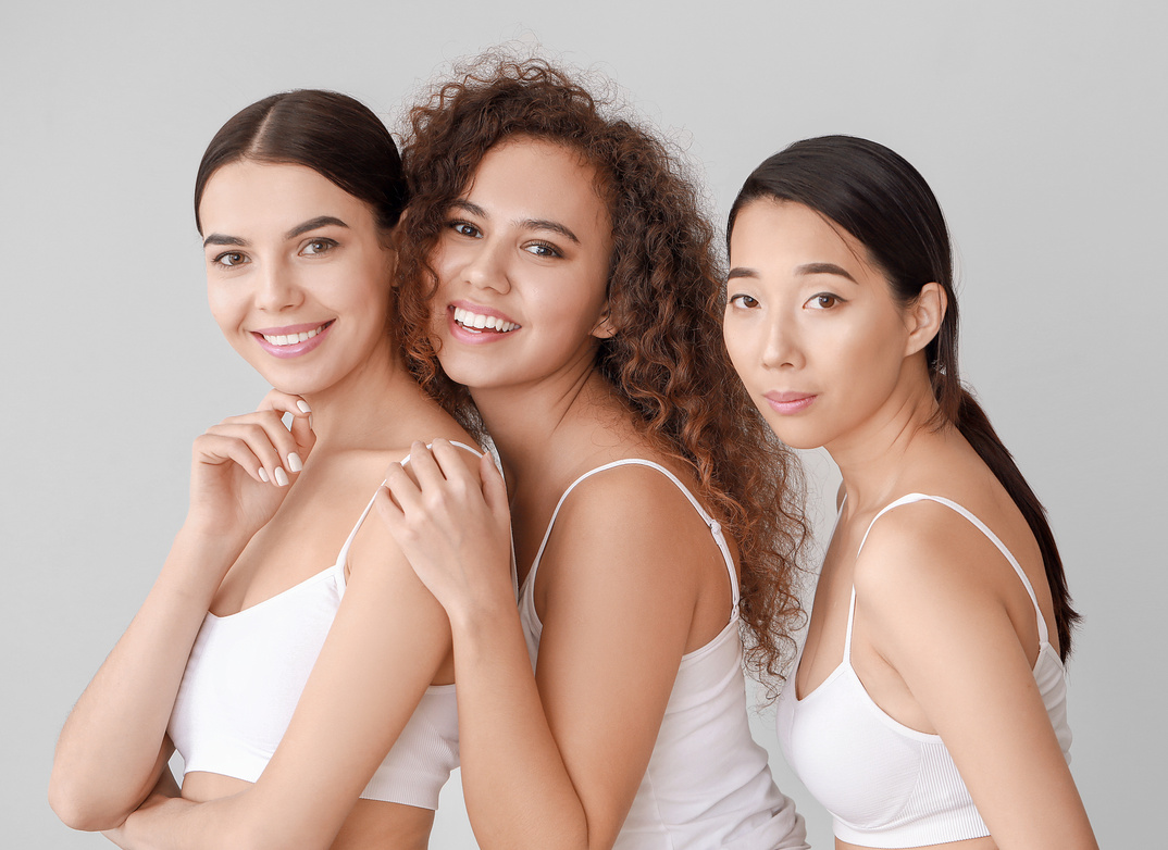 Women with Healthy Skin on Light Background